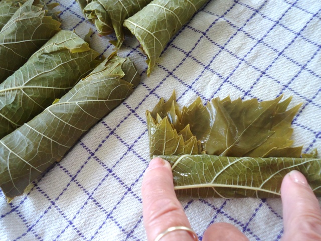 Grape leaves being rolled