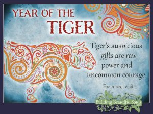 The image of a tiger, created with swirling lines and stylized floral shapes is headlined with the words: Year of the Tiger and the subtext reads: Tiger's auspicious gifts are raw power and uncommon courage